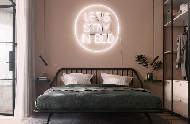 neon sign behind bed