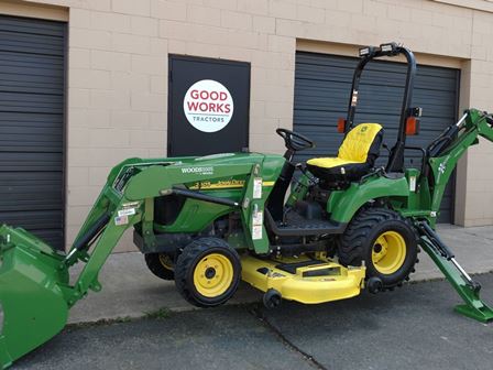 Riding Lawn Mower with Backhoe Attachment